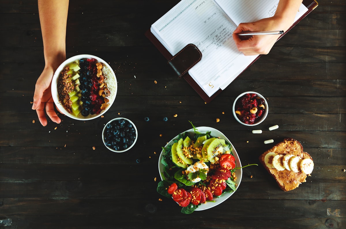 Nutritionist preparing healthy food and supplements